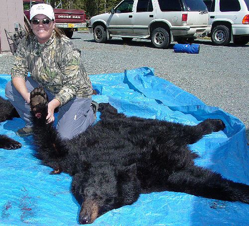 Corey with a Price William Sound black bear taken in June, 2003.