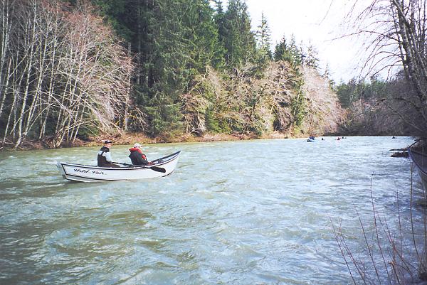 With waters at flood stage, we give chase to the kayakers in the upper Sol Duc during a whitewater run.