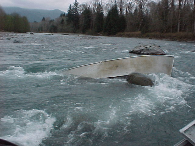 The upper Hoh claims a drifter from an unattentive rower.