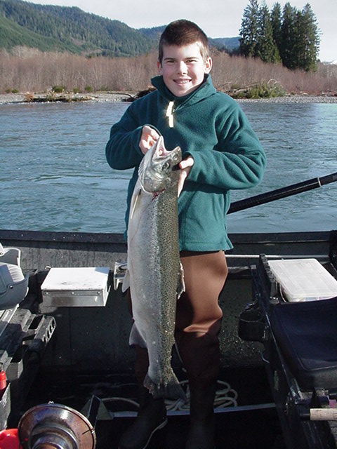 Peter hoists up a nice hatchery fish headed for the dinner table.