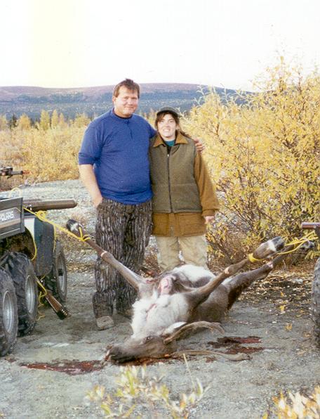 Corey and her Dad, Steve prepare to dress out Corey's caribou.