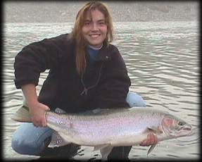 Fishgal with an absolutely enormous hen steelhead