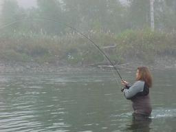 Corey playing her first steelhead she's hooked on the flyrod!