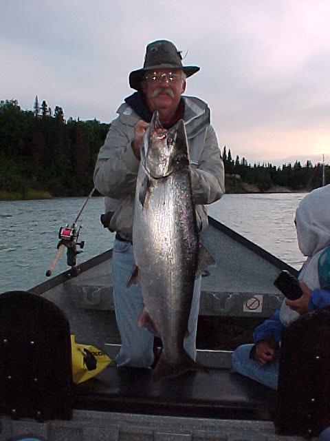 Al Berry, one of regular guests, shows off one of the many fine kings he's caught over the years with us on Bob's Kasilof boat.